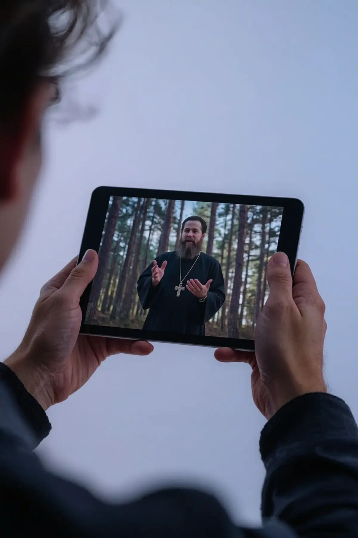 Pastor streaming a church service with reliable web hosting